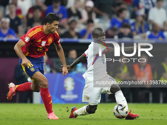 Rodrigo Hernandez defensive midfield of Spain and Manchester City and N'Golo Kante defensive midfield of France and Al-Ittihad Club compete...