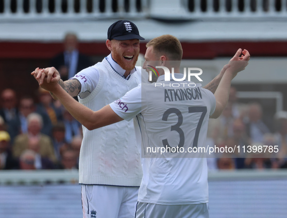 England's Gus Atkinson (Surrey) is making his debut and celebrating his first wicket with England's Ben Stokes (Durham) during the Rothesay...