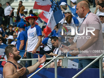 PARIS, FRANCE - JULY 08:
Piotr Malachowski (R), a Polish retired discus thrower, chatting with Pawel FAJDEK (L), during the Men's Hammer Thr...