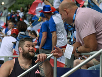 PARIS, FRANCE - JULY 08:
Piotr Malachowski (R), a Polish retired discus thrower, chatting with Pawel FAJDEK (L), during the Men's Hammer Thr...