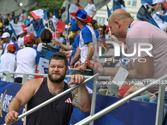 PARIS, FRANCE - JULY 08:
Piotr Malachowski (R), a Polish retired discus thrower, chatting with Pawel FAJDEK (L), during the Men's Hammer Thr...