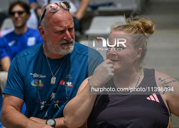 PARIS, FRANCE - JULY 08:
Alexandra TAVERNIER of France, with her father and coach, Christophe TAVERNIER, during the Women's Hammer Throw, at...