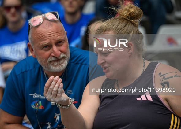 PARIS, FRANCE - JULY 08:
Alexandra TAVERNIER of France, with her father and coach, Christophe TAVERNIER, during the Women's Hammer Throw, at...