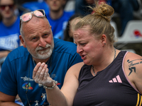 PARIS, FRANCE - JULY 08:
Alexandra TAVERNIER of France, with her father and coach, Christophe TAVERNIER, during the Women's Hammer Throw, at...