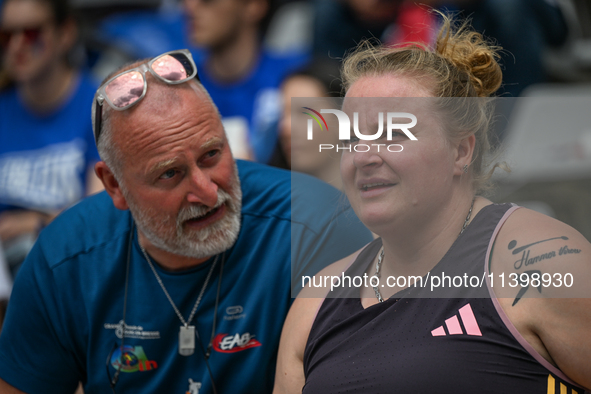 PARIS, FRANCE - JULY 08:
Alexandra TAVERNIER of France, with her father and coach, Christophe TAVERNIER, during the Women's Hammer Throw, at...