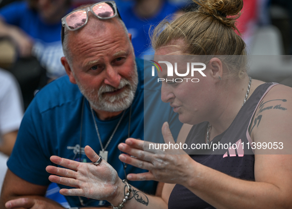 PARIS, FRANCE - JULY 08:
Alexandra TAVERNIER of France, with her father and coach, Christophe TAVERNIER, during the Women's Hammer Throw, at...