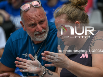 PARIS, FRANCE - JULY 08:
Alexandra TAVERNIER of France, with her father and coach, Christophe TAVERNIER, during the Women's Hammer Throw, at...