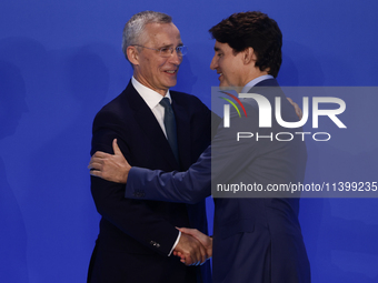 Secretary General of NATO Jens Stoltenberg and Prime Minister of Canada Justin Trudeau during welcome ceremony of the NATO Summit in Washing...