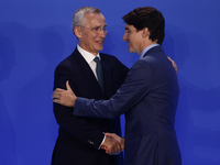 Secretary General of NATO Jens Stoltenberg and Prime Minister of Canada Justin Trudeau during welcome ceremony of the NATO Summit in Washing...