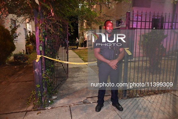 A police officer is standing watch at the crime scene. One person is shot and killed in Washington, D.C., United States, on July 10, 2024. O...