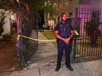 A police officer is standing watch at the crime scene. One person is shot and killed in Washington, D.C., United States, on July 10, 2024. O...