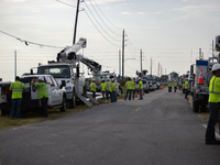 Electrical linemen are assembling near FM-3005 in Galveston, Texas, on July 10, 2024. 1.1 million Texans in and around the Houston area are...