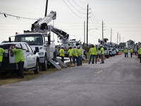 Electrical linemen are assembling near FM-3005 in Galveston, Texas, on July 10, 2024. 1.1 million Texans in and around the Houston area are...