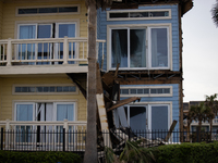 Damage is being seen on a building in Galveston, Texas, on July 10, 2024. (