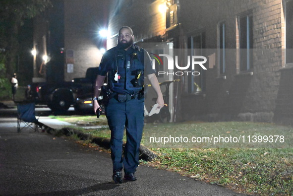 A police officer is at the crime scene. One adult male is injured in a shooting in Washington, D.C., United States, on July 10, 2024. On Wed...