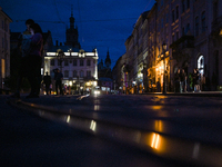 People are seeing in Rynok Square during a power outage at night in Lviv, Ukraine, on July 5, 2024. NO USE RUSSIA. NO USE BELARUS. (