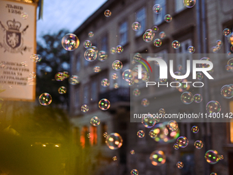 Soap bubbles are capturing light near the Lviv Soap Workshop in Lviv, Ukraine, on July 5, 2024. NO USE RUSSIA. NO USE BELARUS. (