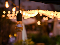 A light bulb is hanging in one of the outdoor cafes in Lviv, Ukraine, on July 5, 2024. NO USE RUSSIA. NO USE BELARUS. (