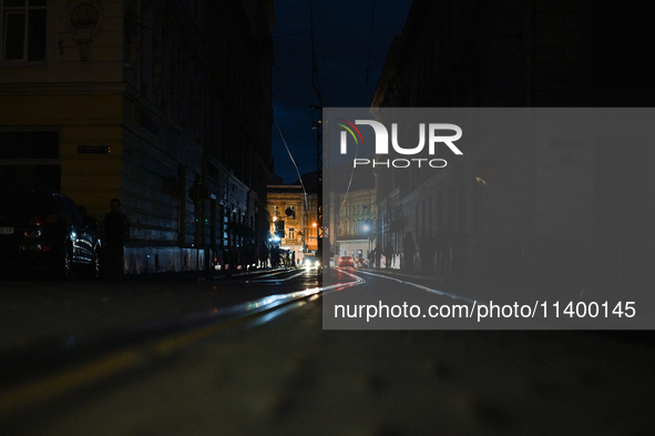 Tram tracks are passing through Katedralna Square at night in Lviv, Ukraine, on July 5, 2024. NO USE RUSSIA. NO USE BELARUS. 