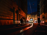 A tram is running in Katedralna Square at night in Lviv, Ukraine, on July 5, 2024. NO USE RUSSIA. NO USE BELARUS. (