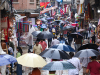 A marketway in Kathmandu, Nepal, on July 11, 2024, is filling with umbrellas as rain continues to pour. Nepal is recording heavy rainfall si...