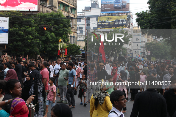 A Muslim devotee is participating in the 4th day of the Muharram festival in Kolkata, India, on July 11, 2024. 