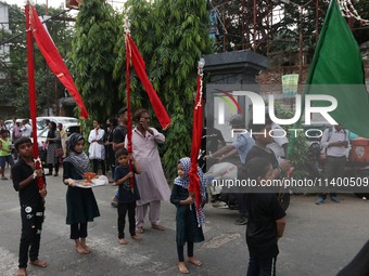 A Muslim devotee is participating in the 4th day of the Muharram festival in Kolkata, India, on July 11, 2024. (