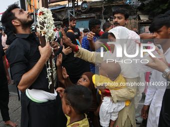 A Muslim devotee is participating in the 4th day of the Muharram festival in Kolkata, India, on July 11, 2024. (