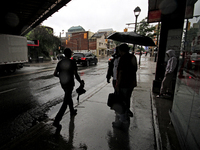 Pedestrians are walking along the street and waiting for public transportation on Main Street in Brampton, Ontario, on July 10, 2024. Remnan...