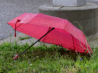 A discarded umbrella is lying near the Brampton Innovation District train station in Brampton, Ontario, on July 10, 2024. Remnants of Hurric...