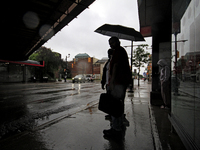 Pedestrians are waiting for public transportation on Main Street in Brampton, Ontario, on July 10, 2024. Remnants of Hurricane Beryl are pas...