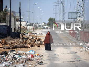 Displaced Palestinians, who are fleeing north Gaza after being ordered by the Israeli army to move southward amid the Israel-Hamas conflict,...