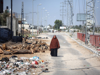 Displaced Palestinians, who are fleeing north Gaza after being ordered by the Israeli army to move southward amid the Israel-Hamas conflict,...