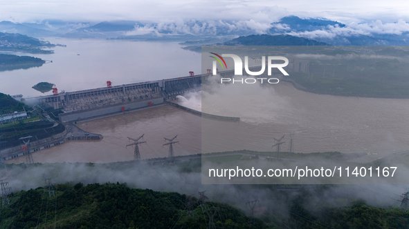 The Three Gorges Dam is opening three holes to release flood water at sunset in Yichang, Hubei province, China, on July 11, 2024. 