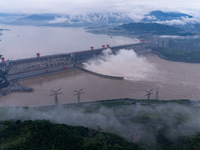 The Three Gorges Dam is opening three holes to release flood water at sunset in Yichang, Hubei province, China, on July 11, 2024. (