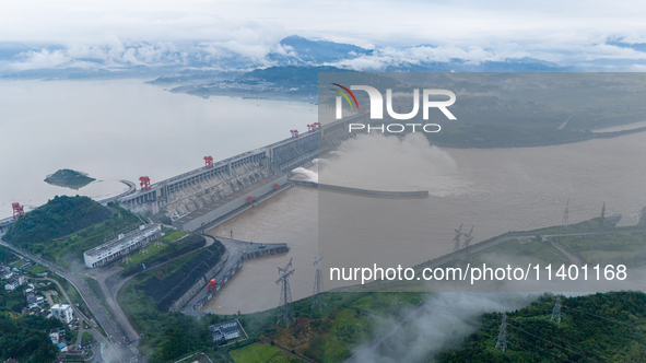 The Three Gorges Dam is opening three holes to release flood water at sunset in Yichang, Hubei province, China, on July 11, 2024. 