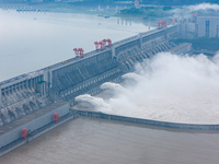 The Three Gorges Dam is opening three holes to release flood water at sunset in Yichang, Hubei province, China, on July 11, 2024. (