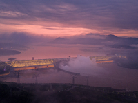 The Three Gorges Dam is opening three holes to release flood water at sunset in Yichang, Hubei province, China, on July 11, 2024. (