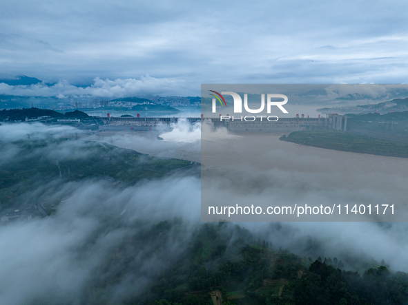 The Three Gorges Dam is opening three holes to release flood water at sunset in Yichang, Hubei province, China, on July 11, 2024. 