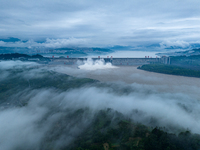 The Three Gorges Dam is opening three holes to release flood water at sunset in Yichang, Hubei province, China, on July 11, 2024. (