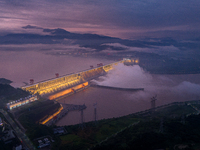 The Three Gorges Dam is opening three holes to release flood water at sunset in Yichang, Hubei province, China, on July 11, 2024. (