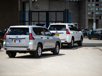 Cars with their license plates covered are part of a security detail of the National Protection Unit (UNP) and are escorting former paramili...