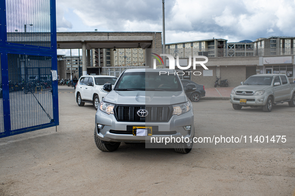 Cars with their license plates covered are part of a security detail of the National Protection Unit (UNP) and are escorting former paramili...