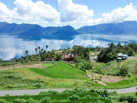 An aerial view is showing Lake Maninjau in Agam Regency, West Sumatra, Indonesia, on July 11, 2024. The Maninjau caldera is being formed by...