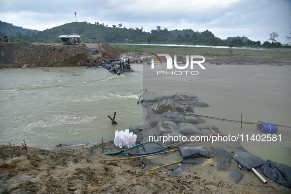 Dumping of Mega Geo bags is underway at the Hatimura embankment, constructed at the source of Kolong River in Koliabor, Nagaon District, Ass...