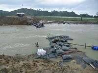 Dumping of Mega Geo bags is underway at the Hatimura embankment, constructed at the source of Kolong River in Koliabor, Nagaon District, Ass...