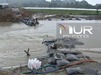 Dumping of Mega Geo bags is underway at the Hatimura embankment, constructed at the source of Kolong River in Koliabor, Nagaon District, Ass...