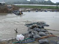 Dumping of Mega Geo bags is underway at the Hatimura embankment, constructed at the source of Kolong River in Koliabor, Nagaon District, Ass...