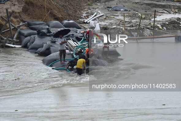 Dumping of Mega Geo bags is underway at the Hatimura embankment, constructed at the source of Kolong River in Koliabor, Nagaon District, Ass...