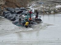 Dumping of Mega Geo bags is underway at the Hatimura embankment, constructed at the source of Kolong River in Koliabor, Nagaon District, Ass...